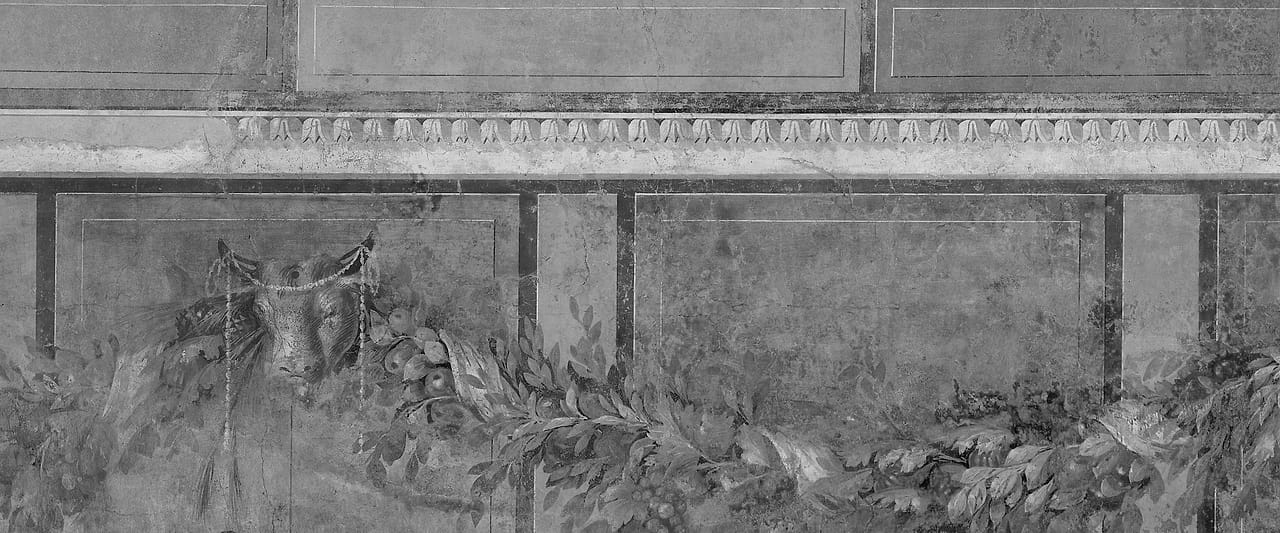 A Roman fresco of painted architecture, columns and openings receding into depth.